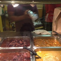 Photo taken at Golden Krust Caribbean Restaurant by Sandy J. on 12/1/2012