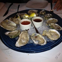 Photo taken at The Grilled Oyster Company by Sandra S. on 4/2/2013