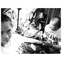 Photo taken at Suckamah Tattoo Studio by Kwan M. on 2/10/2014