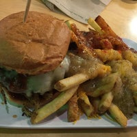 Photo taken at Crave Real Burgers by Tyrone A. on 5/28/2016