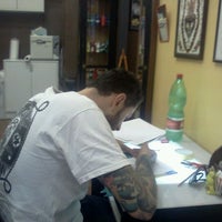 Photo taken at Swan Song Tattoo by Marco on 10/12/2011