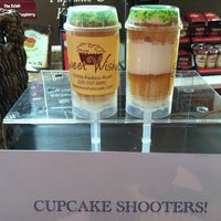 Photo taken at Sweet Wishes Cafe Gourmet Cupcake Shop by Artsey C. on 4/23/2012