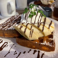 Photo taken at Waffle cafe ORANGE by もちづき た. on 2/26/2022
