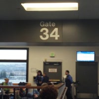 Photo taken at Gate 34 by Derek T. on 12/25/2012