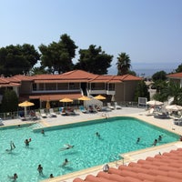 Photo taken at Lagomandra Beach Hotel by Alek on 7/28/2015