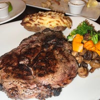 Photo taken at The Keg Steakhouse + Bar - Burnaby by Roman A. on 3/13/2022