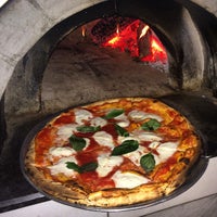 Photo taken at Pizza Mezzaluna by Erika M. on 1/4/2015