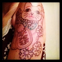 Photo taken at Banzai Tattoo by Adriana P. on 12/7/2012