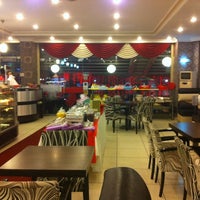 Photo taken at Larende Cafe by Ceyhun A. on 12/19/2012