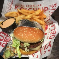Photo taken at Red Robin Gourmet Burgers and Brews by Crystal C. on 3/31/2018