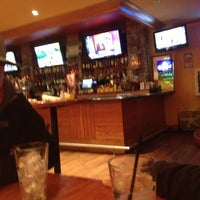 Photo taken at Sporting News Grill by Alexis B. on 12/27/2012