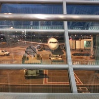 Photo taken at Gate A64 / T64 by Ritvars T. on 2/15/2013