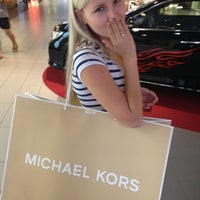 Photo taken at Michael Kors by Katerina S. on 7/27/2013