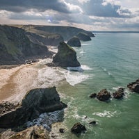 Photo taken at Bedruthan Steps Beach by Andrew F. on 3/27/2018