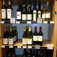 Photo taken at 7th Avenue Wine and Liquor Company by Varun S. on 10/28/2012
