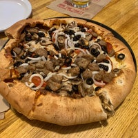 Photo taken at Woodstock&amp;#39;s Pizza by Geoff F. on 6/19/2022