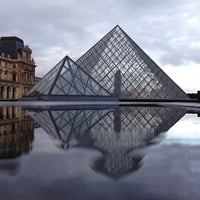 Photo taken at Louvre Pyramid by Bois H. on 10/17/2013