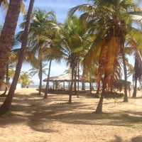 Photo taken at Playa de Boca de Uchire by Aracelis M. on 8/24/2014