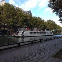 Photo taken at Canal Saint-Martin by Petr K. on 10/23/2013
