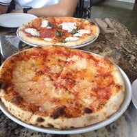 Photo taken at Olio Wood Fired Pizzeria by Delite on 5/17/2014
