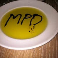 Photo taken at MPD Restaurant by Mariana L. on 10/6/2012
