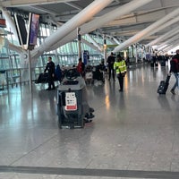 Photo taken at T5 Arrivals Hall by David J. on 2/25/2020
