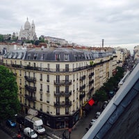 Photo taken at Rue Marguerite de Rochechouart by Katherine K. on 5/8/2015