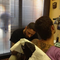 Photo taken at Swan Song Tattoo by MauroLips W. on 9/11/2012