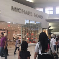 Photo taken at Michael Kors by Monica G. on 7/4/2016