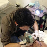 Photo taken at XIII INK Tattoo by Fabrizio P. on 4/27/2013