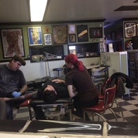 Photo taken at Yer Cheat&amp;#39;n Heart Tattoo &amp;amp; Body Piercing by Kelly M. on 12/26/2013