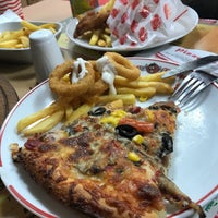 Photo taken at Pizza Tomato by Seyhan T. on 3/7/2018