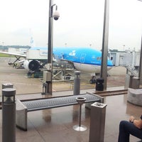 Photo taken at Smoking Area @ T1 Near Gate 36 by Andy L. on 7/14/2013