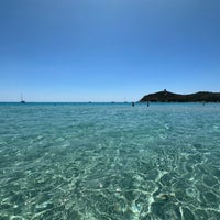 Photo taken at Spiaggia di Porto Giunco by Adam F. on 7/5/2023