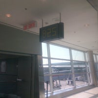Photo taken at Gate B25 by Ivan A. on 3/20/2012