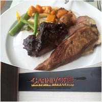 Photo taken at Carnivore Brazilian Churrascaria by Scooter T. on 7/23/2016