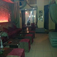 Photo taken at Sahra Hookah Lounge by Cara on 12/27/2012