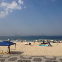 Photo taken at Ipanema Beach by Lucas F. on 5/5/2013