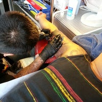 Photo taken at Slangin&amp;#39; Inc. Tattoo by Christina C. on 9/22/2012