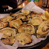 Photo taken at Acme Oyster House by Chris R. on 12/31/2011