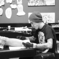 Photo taken at Horns and Halos Tattoo by Mitchell G. on 4/29/2012