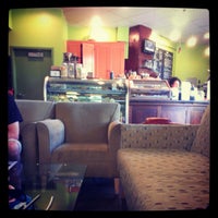 Photo taken at Urban Grind Coffeehouse by Lani P. on 7/12/2012