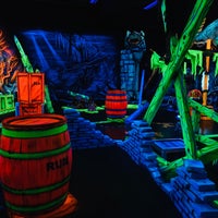 Photo taken at Glowing Greens Mini Golf by Close on 12/1/2018