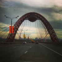 Photo taken at Zhivopisny Bridge by Anton K. on 5/11/2013