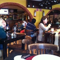 Photo taken at Escarapela, Bodegón Argentino by Miss Roxy M. on 12/31/2012