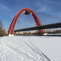 Photo taken at Zhivopisny Bridge by Irina U. on 2/28/2016