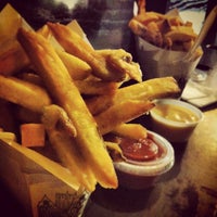 Photo taken at Pommes Frites by Daphne T. on 4/25/2013