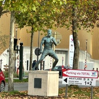 Photo taken at Statue de Jean-Claude Van Damme by Geoffrey B. on 10/30/2022