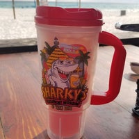Photo taken at Sharky&#39;s Beachfront Restaurant by Lora K. on 8/15/2019