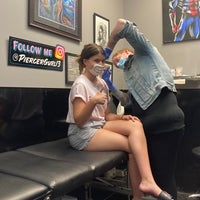Photo taken at New Tribe Tattooing &amp;amp; Piercing by Delyn S. on 8/8/2020